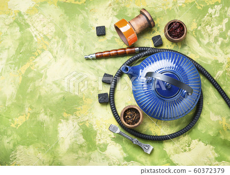 Turkish smoking hookah and tea. 60372379