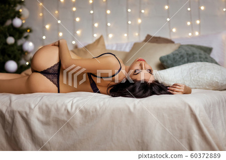 Sensual sexy woman in erotic black lace lingerie - Stock Photo