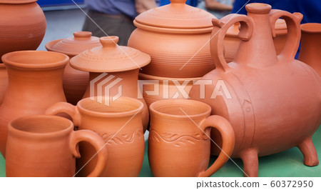 Handmade ceramic tableware is sold at the fair 60372950