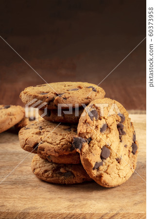 Chocolate chip cookies, gluten-free, a close-up of a stack on a dark rustic background with a place for text 60373958