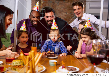 Portrait of happy family celebrating a birthday at home 60374167