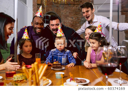Portrait of happy family celebrating a birthday at home 60374169
