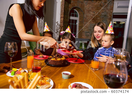 Portrait of happy family celebrating a birthday at home 60374174