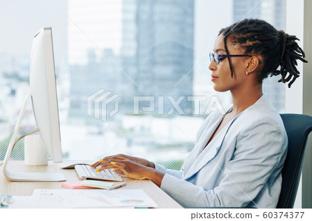 Stylish businesswoman working on laptop Stylish businesswoman working on laptop 60374377