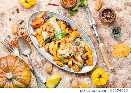 Baked chicken with pumpkin. 60374613