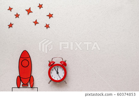 Red cartoon rocket on a launch pad 60374853