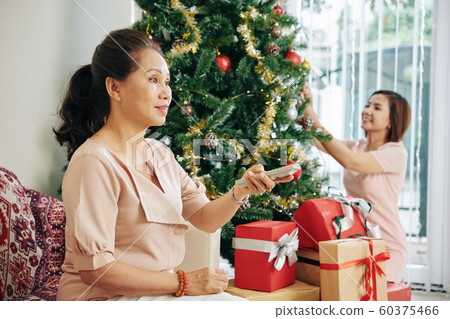 Mother and daughter preparing for holiday 60375466