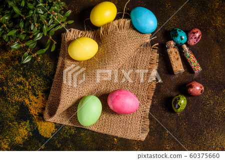 Easter cake and colorful eggs on a dark background Easter cake and colorful eggs on a dark background 60375660