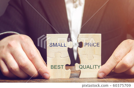 A businessman collects wooden puzzles with the words Small price - best quality. The concept of profitable deals for buyers. Low cost of goods. Quality service. Justified money. High rating. Marketing 60375709