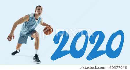 Young caucasian basketball player against white studio background 60377048