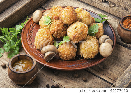 Mushrooms in breadcrumbs. 60377460