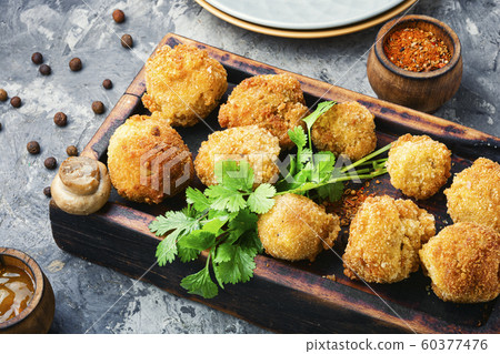 Mushrooms in breadcrumbs. Mushrooms in breadcrumbs. 60377476