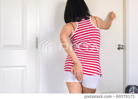 Woman using toilet and suffers from Diarrhea and Hemorrhoids after wake up in morning at home Woman using toilet and suffers from Diarrhea and Hemorrhoids after wake up in morning at home 60378175