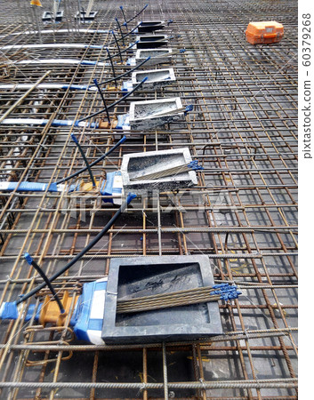 Pre-stress cable tendons and anchor part of the pre-stressed concrete. It is a construction technology to get better concrete slab quality with larger span. Pre-stress cable tendons and anchor part of the pre-stressed concrete. It is a construction technology to get better concrete slab quality with larger span. 60379268