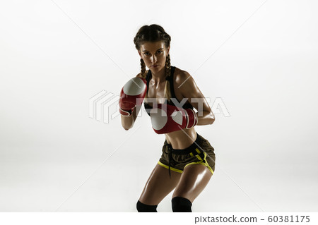 Fit caucasian woman in sportswear boxing isolated on white studio background 60381175
