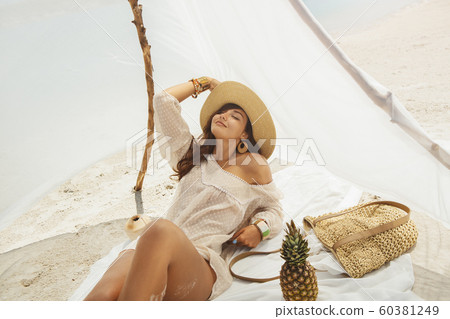 Woman Resting on the Beach During Vacation 60381249