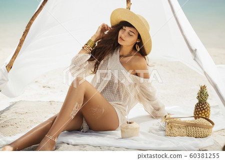 Woman Resting on the Beach During Vacation 60381255