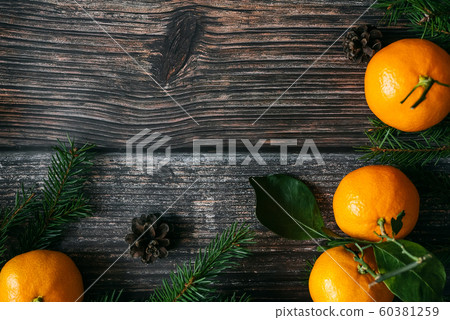 Christmas card with tangerines, fir branches and cones 60381259