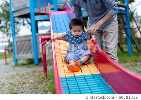 Infants playing in the park 60381319
