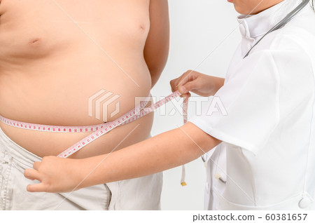 Little doctor measuring obese child waist body fat Little doctor measuring obese child waist body fat 60381657