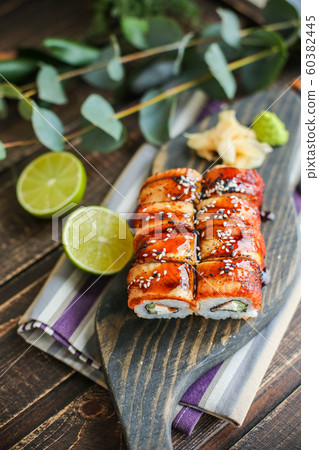 sushi with salmon and avocado. Sushi roll with salmon and tempura shrimp sushi with salmon and avocado. Sushi roll with salmon and tempura shrimp 60382445