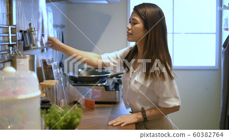 Shopping concepts. Young women are buying kitchen Shopping concepts. Young women are buying kitchen 60382764