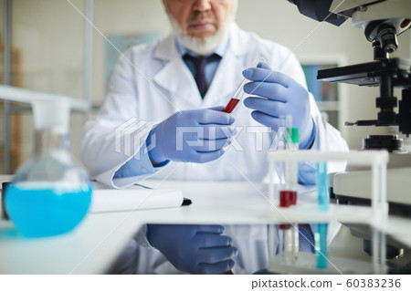 Doctor working with blood samples Doctor working with blood samples 60383236