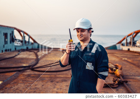Marine Deck Officer or Chief mate on deck of offshore vessel or ship , wearing PPE personal 60383427