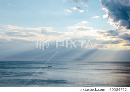 yacht in the sea rays from clouds landscape yacht in the sea rays from clouds landscape 60384752