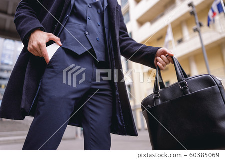 Low angle picture of busy man that going on meeting 60385069