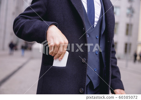 Close up of male hand that taking telephone 60385072