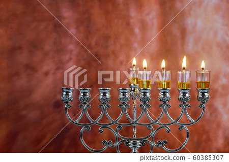 Five Hanukkah candles are burning on light of Five Hanukkah candles are burning on light of 60385307