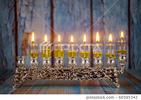 Brightly Glowing Hanukkah Menorah soft focus Brightly Glowing Hanukkah Menorah soft focus 60385342