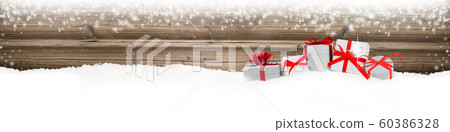 Gifts with Red Ribbons and Bag on Wooden Gifts with Red Ribbons and Bag on Wooden 60386328