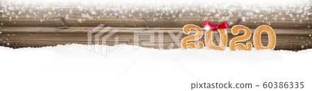 Gingerbread New Year 2020 on Wooden Background Gingerbread New Year 2020 on Wooden Background 60386335