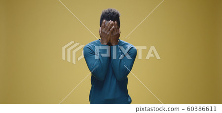 Young man crying to camera 60386611