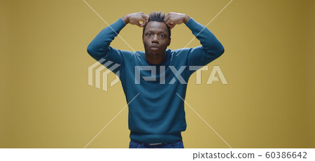 Young man complaining to camera Young man complaining to camera 60386642