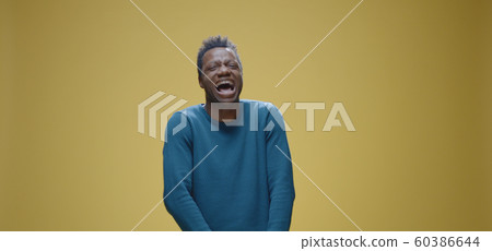 Man with taped mouth looking at camera 60386644