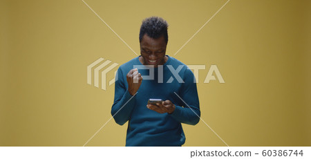 Young man celebrating success 60386744