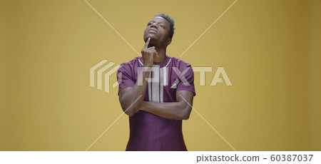 Pensive man touching chin Pensive man touching chin 60387037