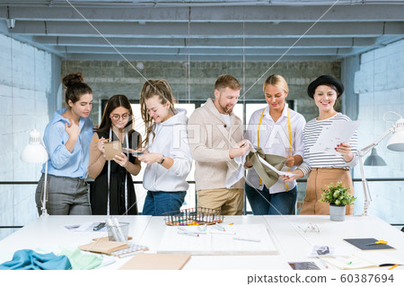 Group of six young creative designers working over new fashion collection 60387694