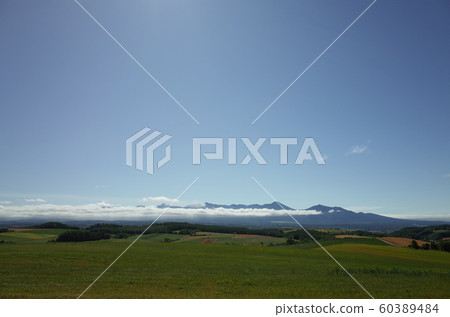 Sky, clouds and Tokachidake mountain range Sky, clouds and Tokachidake mountain range 60389484