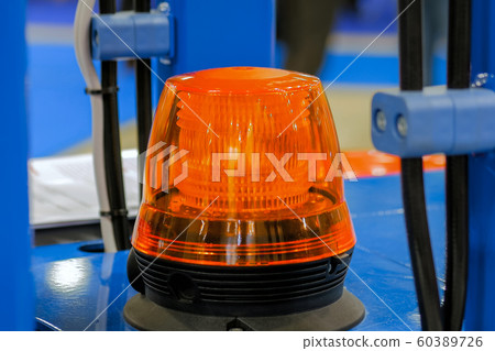 Close up of warning orange beacon flashing Close up of warning orange beacon flashing 60389726