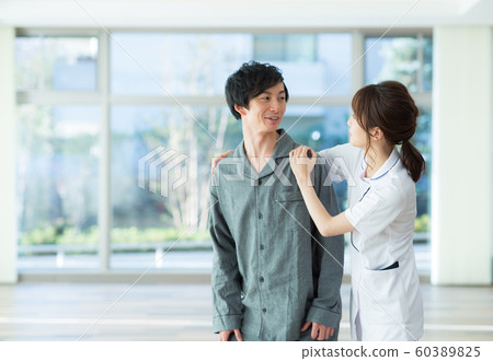 Patient and nurse 60389825