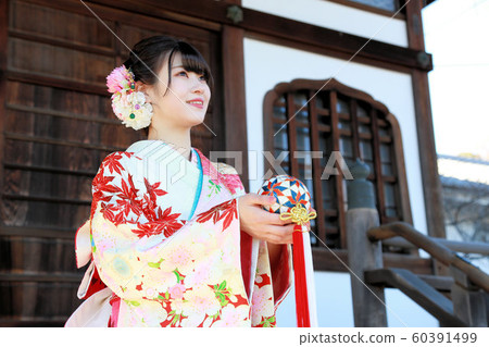 Japanese woman in adult kimono shooting and sunny appearance Japanese woman in adult kimono shooting and sunny appearance 60391499
