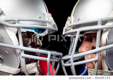 Two American football players head to head Two American football players head to head 60395135
