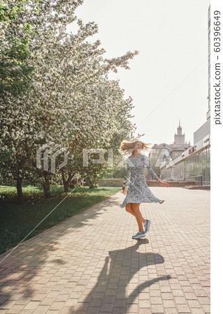 beautiful girl holding flowers. March 8: woman among flowers. the concept of congratulations, women's holidays, natural make up beautiful girl holding flowers. March 8: woman among flowers. the concept of congratulations, women's holidays, natural make up 60396649