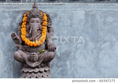 Ganesha sitting in meditating yoga pose in hindu 60397275
