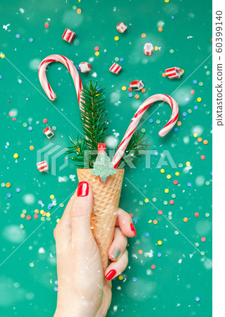 Christmas card with candy canes in waffle cone Christmas card with candy canes in waffle cone 60399140