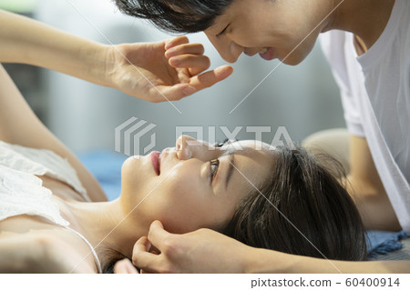 Newlywed Couple Relax Facing Newlywed Couple Relax Facing 60400914